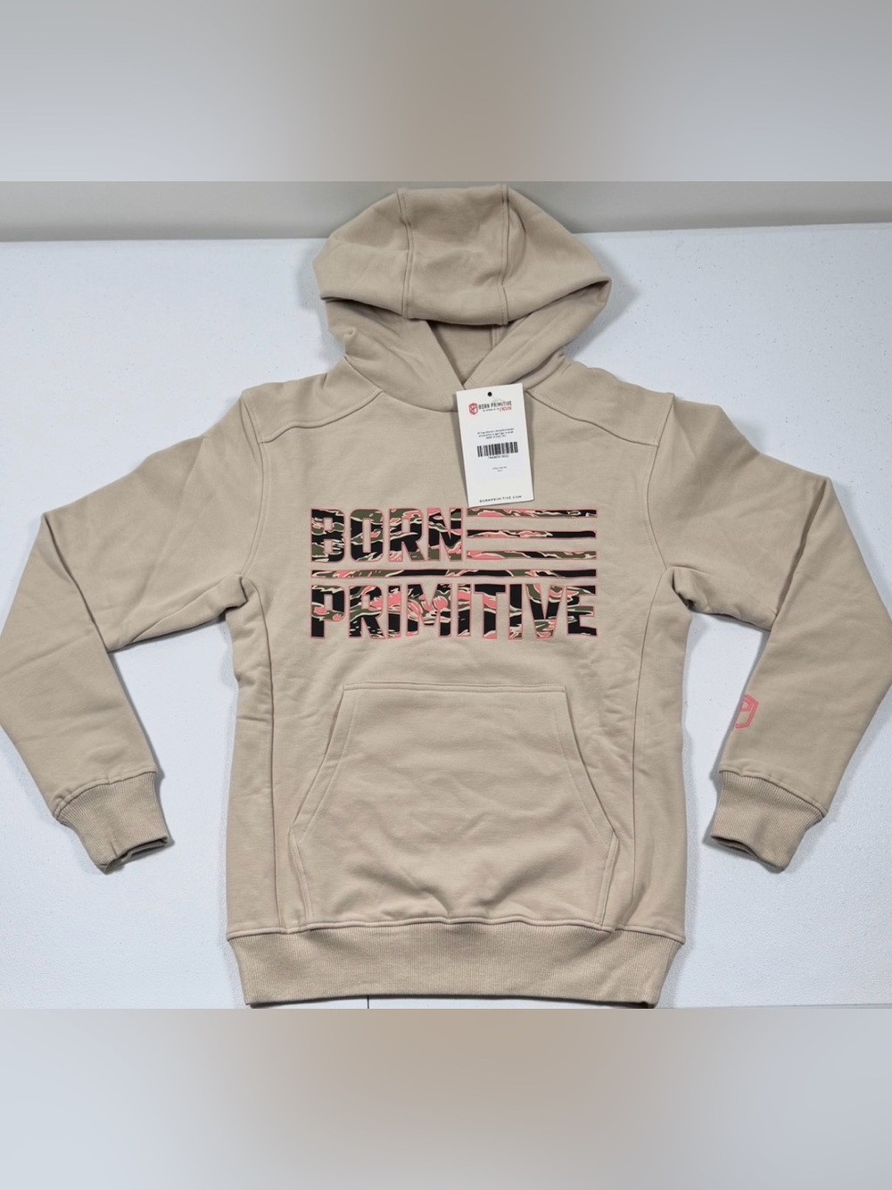 Make a statement in this NWT Born Primitive Women’s Unmatched BP Flag Hoodie